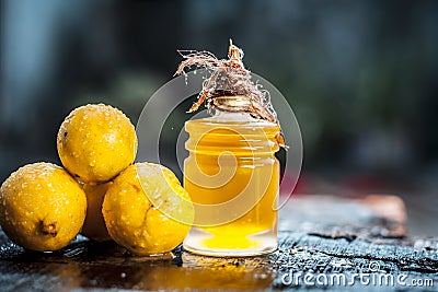 Citrus Ã— limon,Lemon with lemon oil in a transparent bottle.Concept of skin Stock Photo